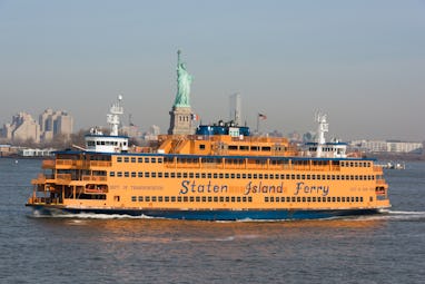 New York, USA – Feb 27th, 2017: The Staten Island Ferry crossing the bay early in the day with the S...