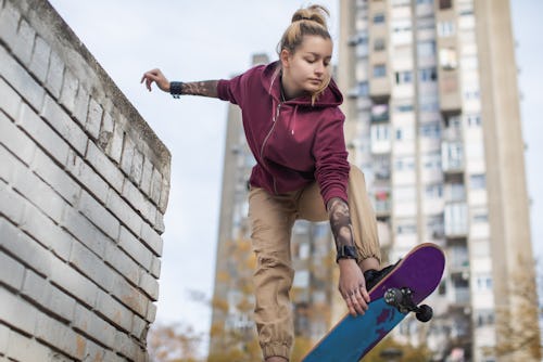 Skater woman jumping on her skateboard. Ophiuchus is not a zodiac sign, but if it were, it might hav...