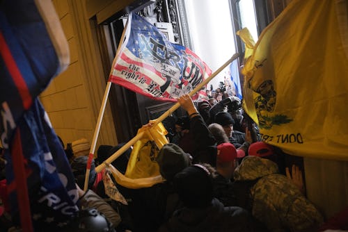 WASHINGTON, DC - JANUARY 06: A pro-Trump mob breaks into the U.S. Capitol on January 06, 2021 in Was...