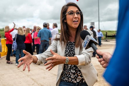 US Rep. Lauren Boebert (R-CO) speaks to a reporter during a visit to the border wall near Pharr, Tex...