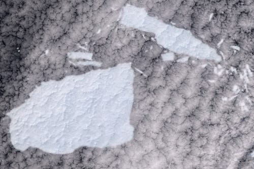SOUTH GEORGIA ISLAND - 1 JANUARY 2021: Shattered Iceberg A-68A near South Georgia Island. (Photo by ...
