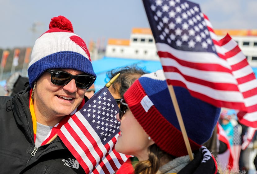 Fans ring cowbells at the Winter Olympics to support their favorite athletes.