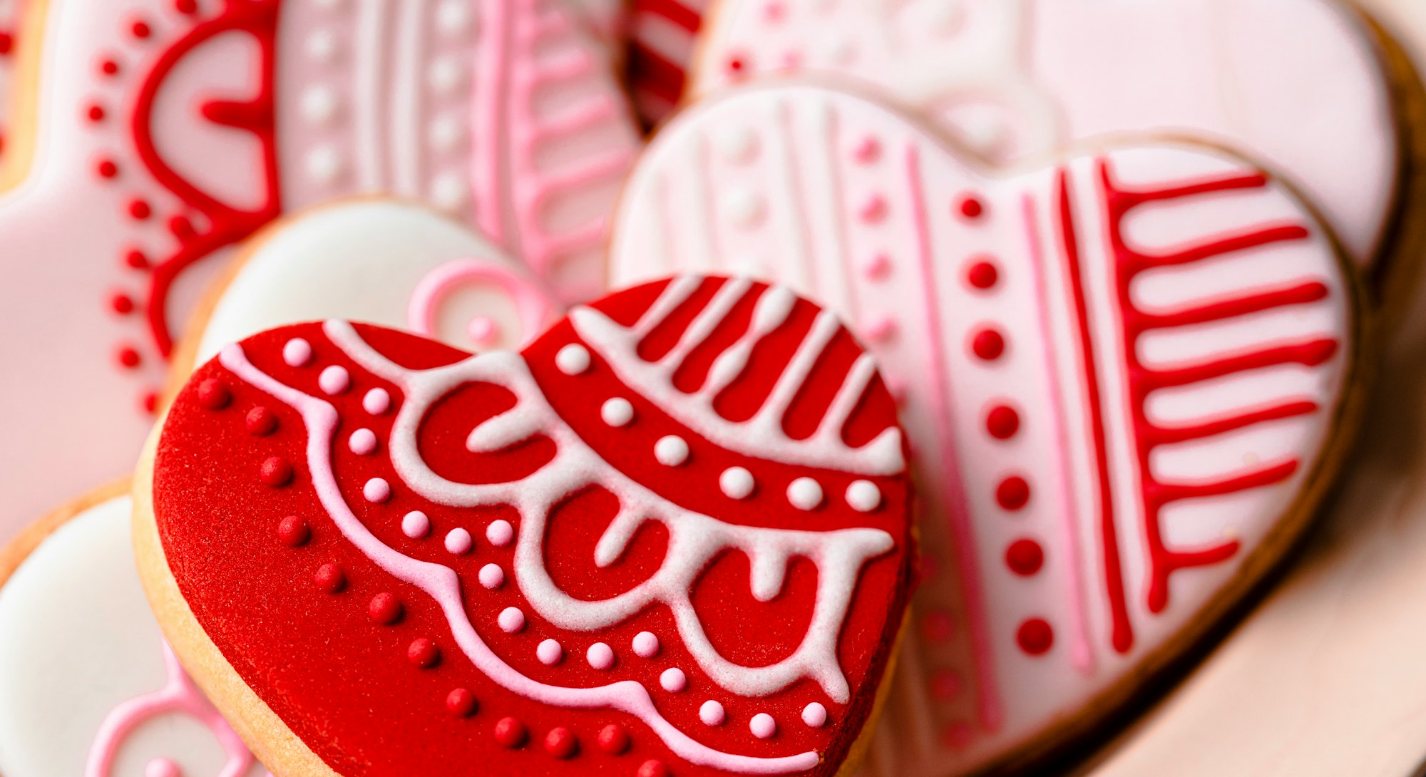 Heart-shaped decorated cookies for tea, studio shot.