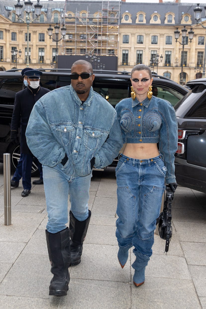 Kanye West and Julia Fox wearing matching denim outfits at Paris Haute Couture Fashion Week. 