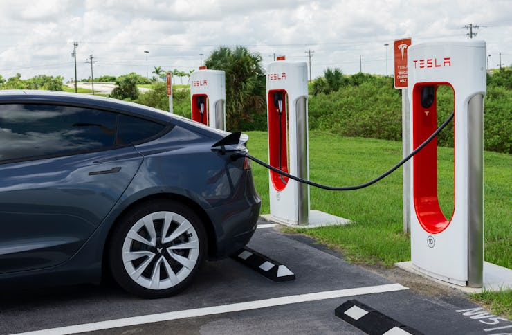 Miami, Florida, USA - August 29, 2021:  Tesla Model Y electric car at Tesla Supercharger charging st...