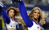ARLINGTON, TEXAS - DECEMBER 26: A Dallas Cowboys cheerleader performs during the game against the Wa...