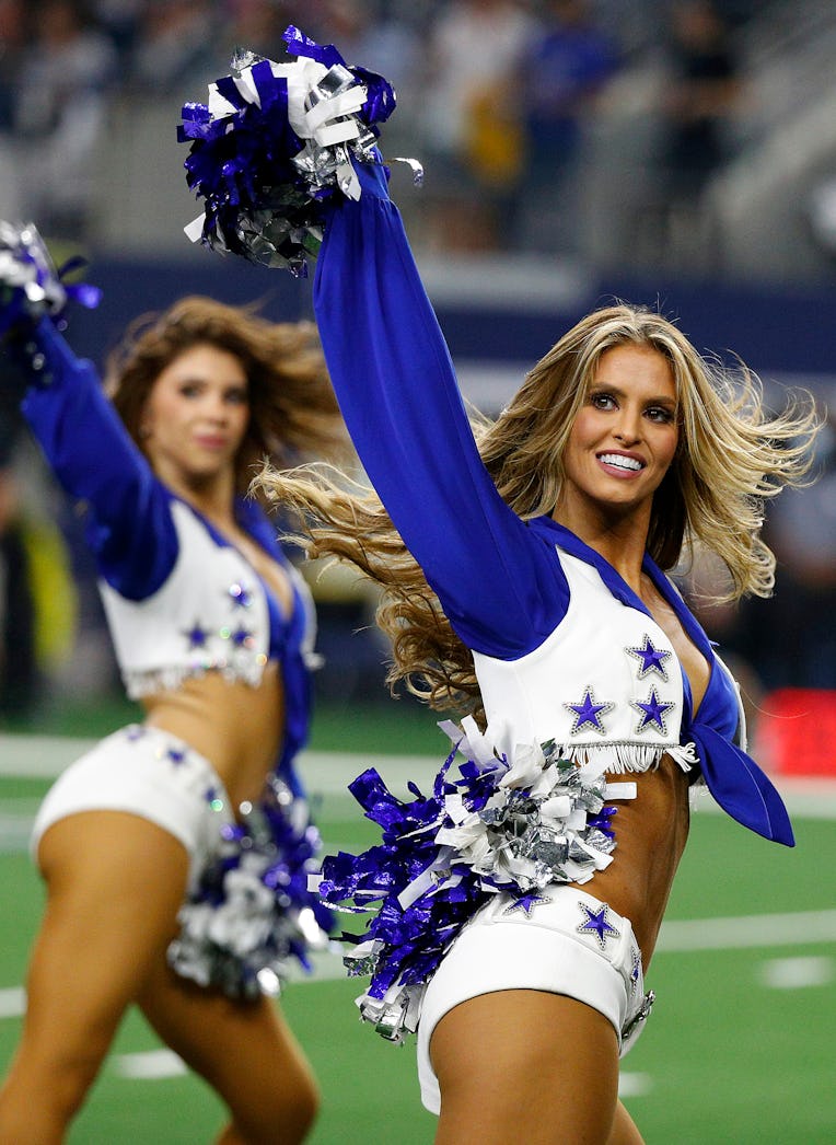 ARLINGTON, TEXAS - DECEMBER 26: A Dallas Cowboys cheerleader performs during the game against the Wa...