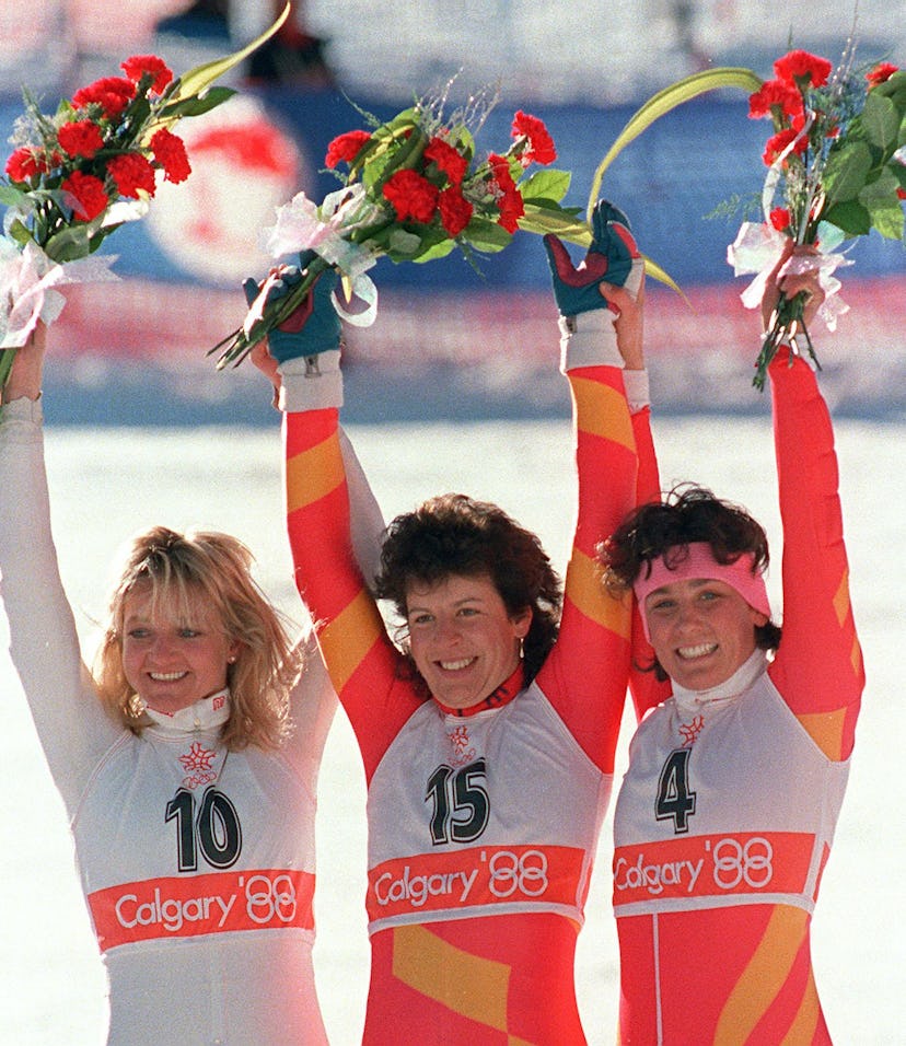 Swiss skier Vreni Schneider (C), flanked by compatriot Maria Walliser (R) and West German Christa Ki...