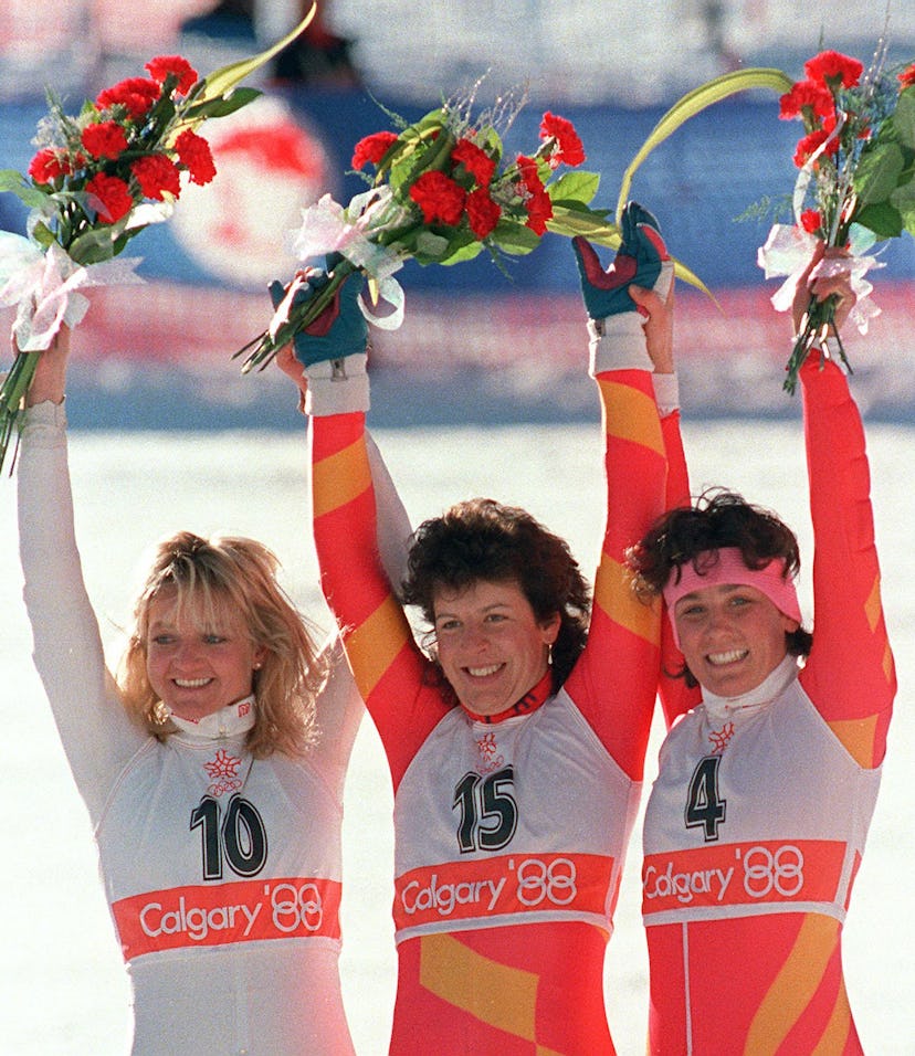 Swiss skier Vreni Schneider (C), flanked by compatriot Maria Walliser (R) and West German Christa Ki...