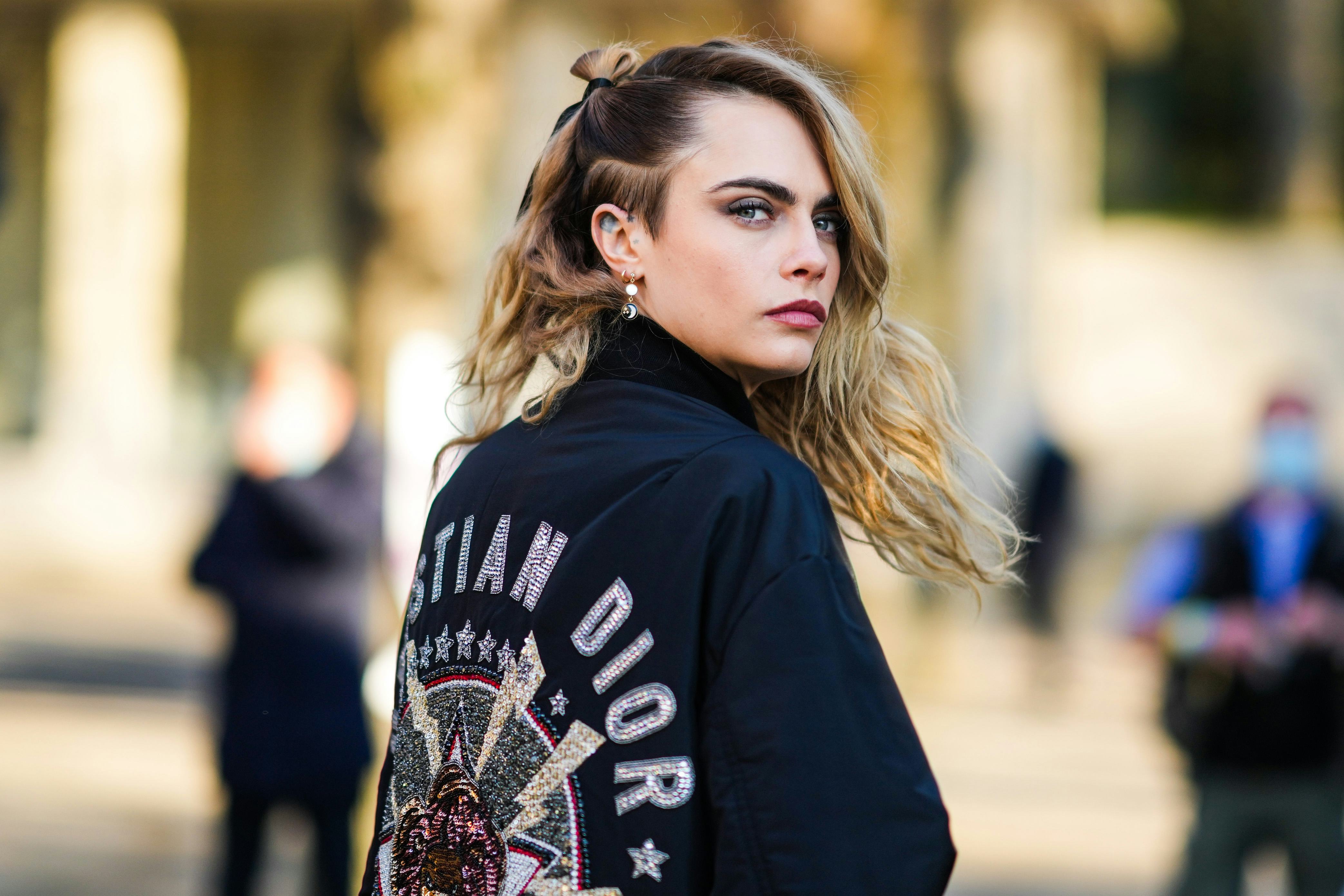 Cara Delevingne attends the Dior Haute Couture Spring/Summer 2022 show.