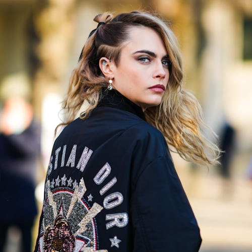 Cara Delevingne attends the Dior Haute Couture Spring/Summer 2022 show.