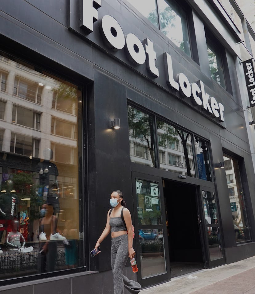 CHICAGO, ILLINOIS - AUGUST 02: A sign hangs above the entrance of a Foot Locker store on August 02,...