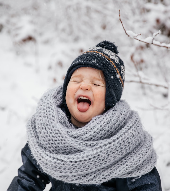 Winter portrait of little boy child in snow. Cute kid - winter