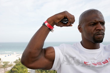 Terry Crews flexes his muscles at Raleigh Hotel. (Photo by: Jeffrey Greenberg/Universal Images Group...