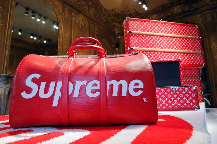 PARIS, FRANCE - MAY 14:  A travel bag entitled "Keepall" by Louis Vuitton x Supreme is displayed dur...