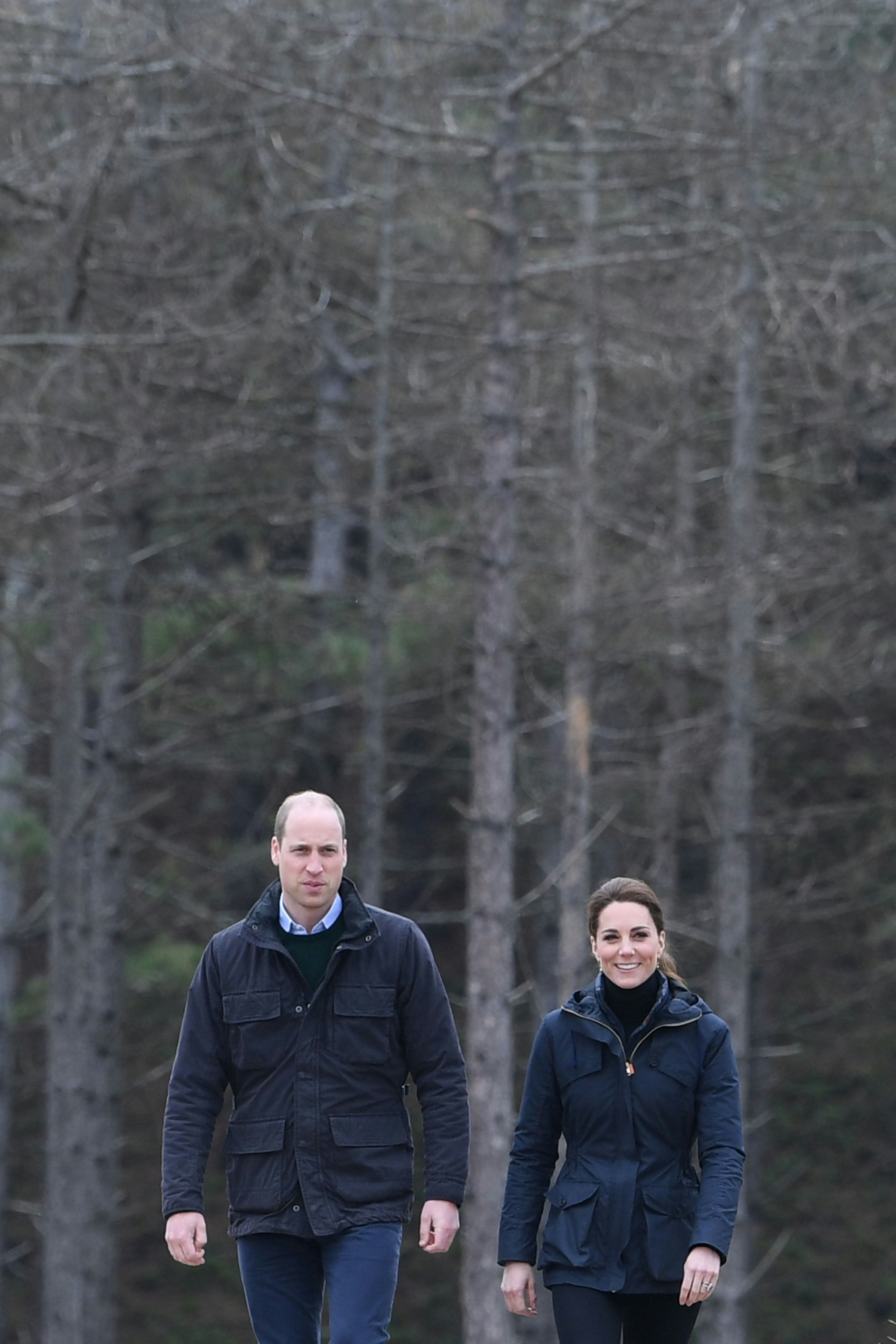 Prince William and Kate Middleton in similar looking jackets for a beach walk.