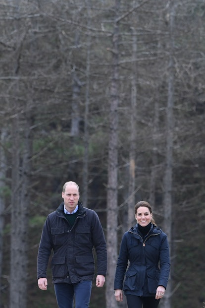 Prince William and Kate Middleton in similar looking jackets for a beach walk. 
