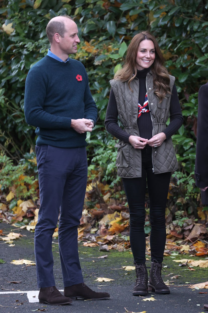 Prince William and Kate Middleton in matching green outfits.