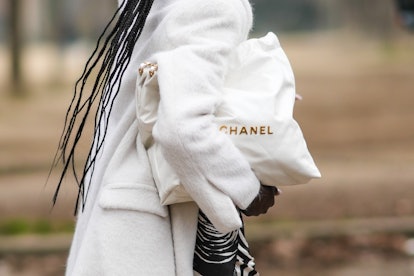 PARIS, FRANCE - JANUARY 25: A model wears a black and white print pattern blazer jacket, a white lar...