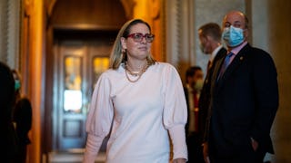 WASHINGTON, DC - NOVEMBER 03: Sen. Kyrsten Sinema (D-AZ) leaves the Senate Chamber following a vote ...