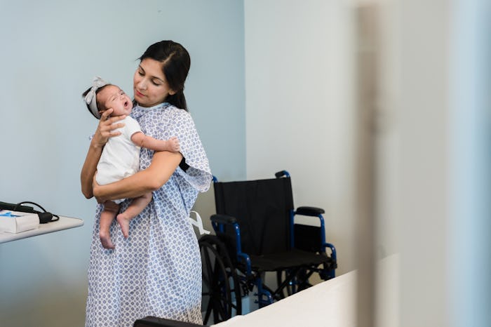 postpartum mom with newborn