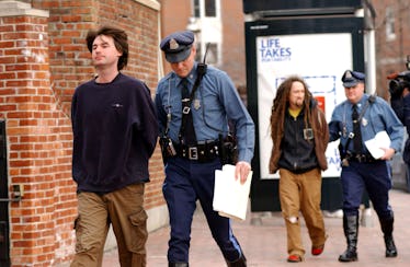 CHARLESTOWN, MA - FEBRUARY 1:  Sean Stevens, 28, (L) and Peter Berdovsky (2nd R), 27, are escorted t...