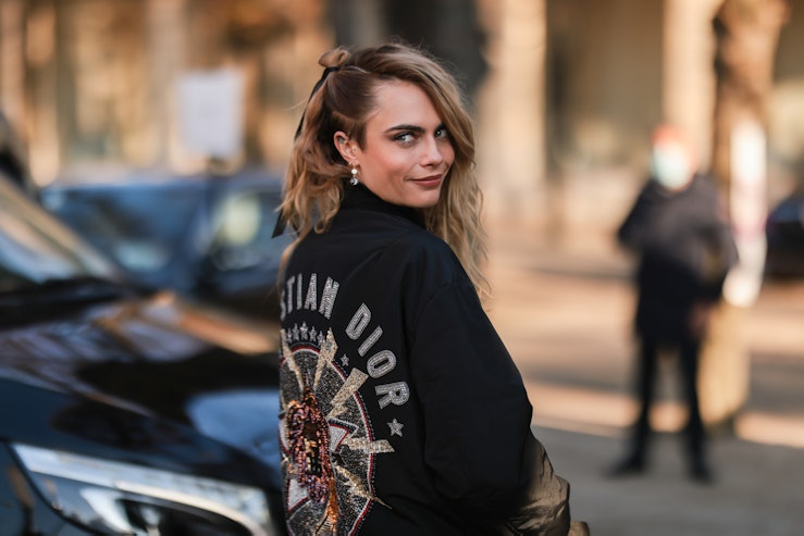 PARIS, FRANCE - JANUARY 24: Cara Delevingne is seen wearing a black Dior jacket outside Dior during ...