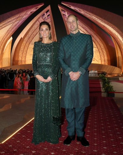 Prince William and Kate Middleton wearing matching emerald green outfits in Pakistan.
