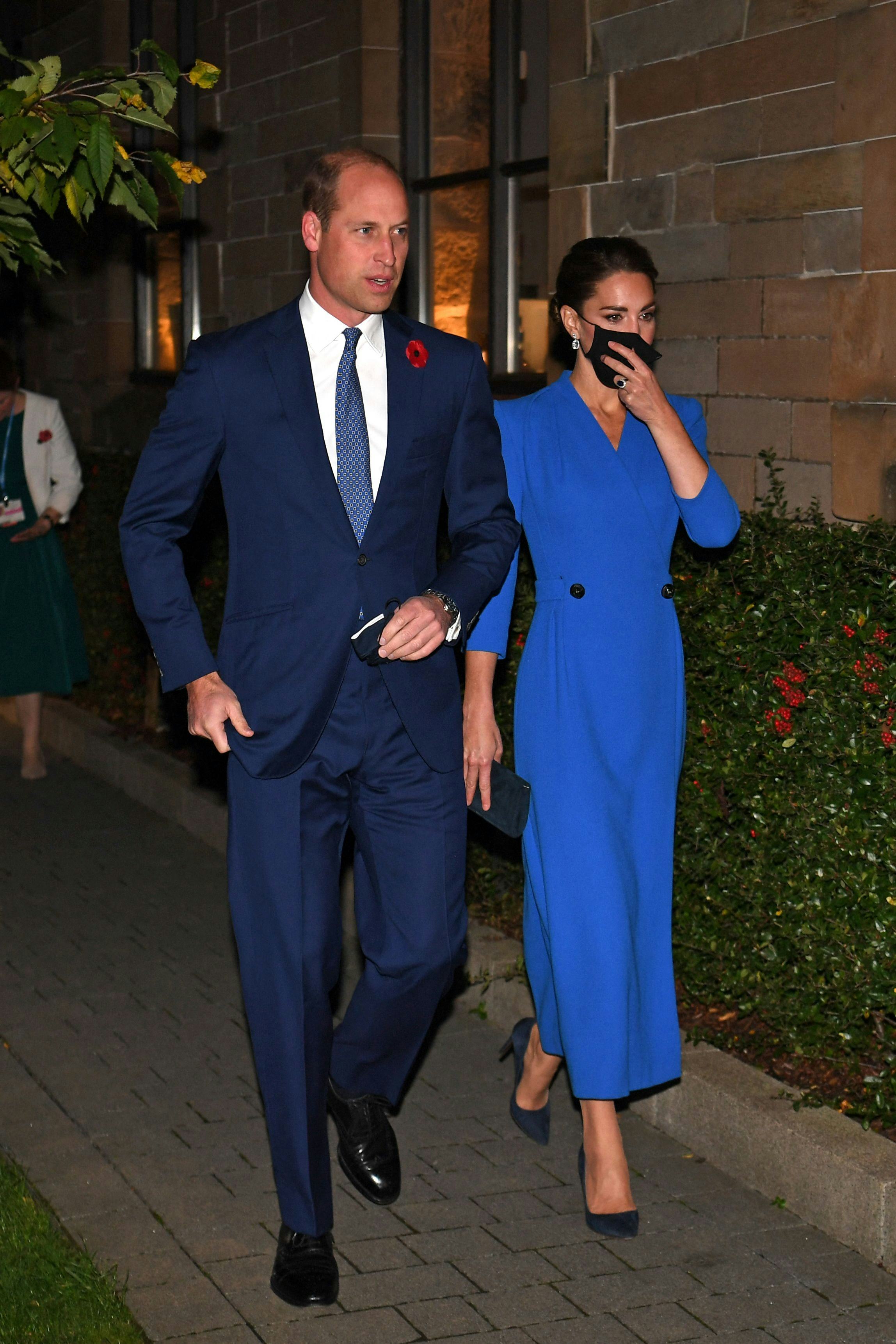 Prince William and Kate Middleton in matching blue outfits.