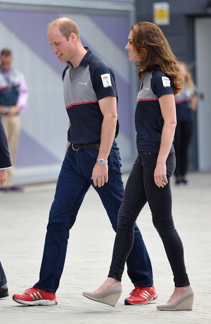 Catherine, Duchess of Cambridge and Prince William, Duke of Cambridge wearing matching shirts at the...
