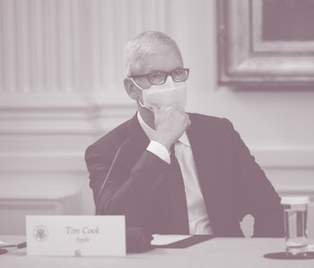 WASHINGTON, DC - AUGUST 25: Apple CEO Tim Cook listens as U.S. President Joe Biden speaks during a m...