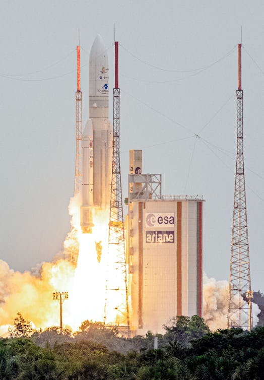 Arianespace's Ariane 5 rocket with NASAs James Webb Space Telescope onboard lifts up from the launch...