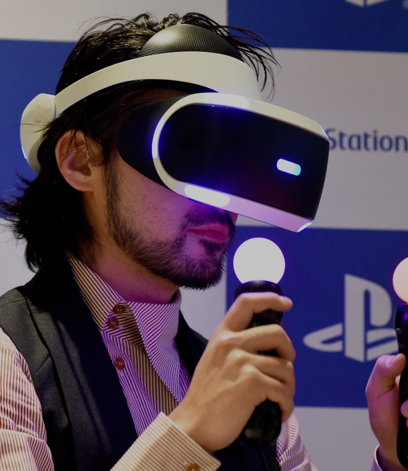Japanese actor Takayuki Yamada uses PlayStation VR (PSVR) headset during the launch of the product a...