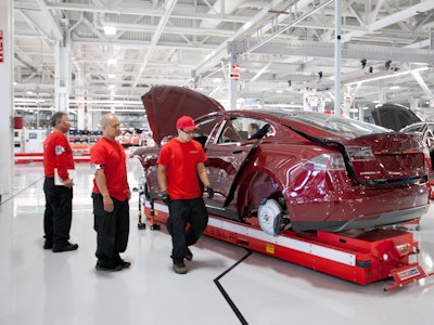 Workmen assemble Model S sedans at the Tesla auto plant in Fremont, Calif. Tuesday, June 12, 2012. P...