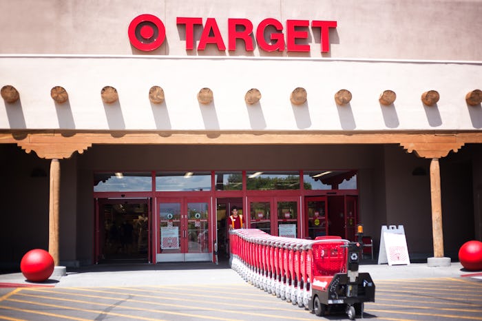 Santa Fe, NM: A Target employee pulls red shopping carts into the Santa Fe NM store. Santa Fe’s Tar...