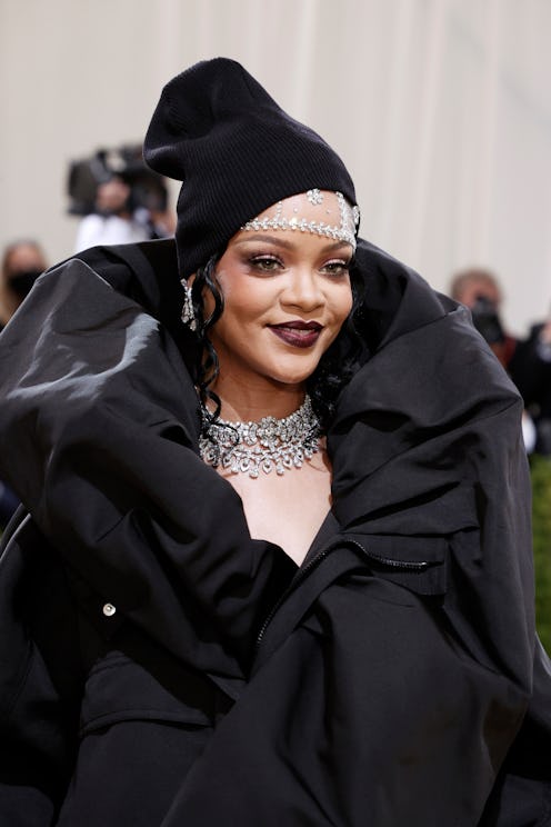 Rihanna debuted her pregnant belly in NYC with long, curly hair.