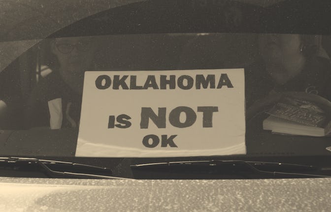 OKLAHOMA CITY, OK - APRIL 9: A sign sits in the window of a car as teachers continue to stage their ...