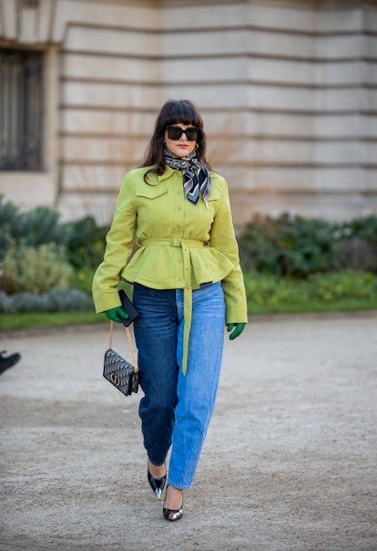 PARIS, FRANCE - JANUARY 24: Gili Biegun is seen wearing green jacket, two tone denim jeans, Dior bag...