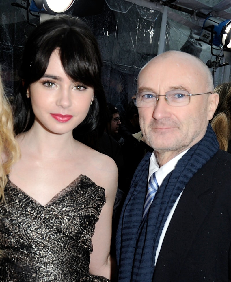 Lily Collins poses with her famous dad, Phil Colins