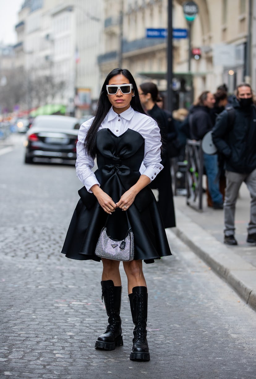PARIS, FRANCE - JANUARY 25:  Miki Cheung wearing black dress, white button up shirt, Prada bag, lace...