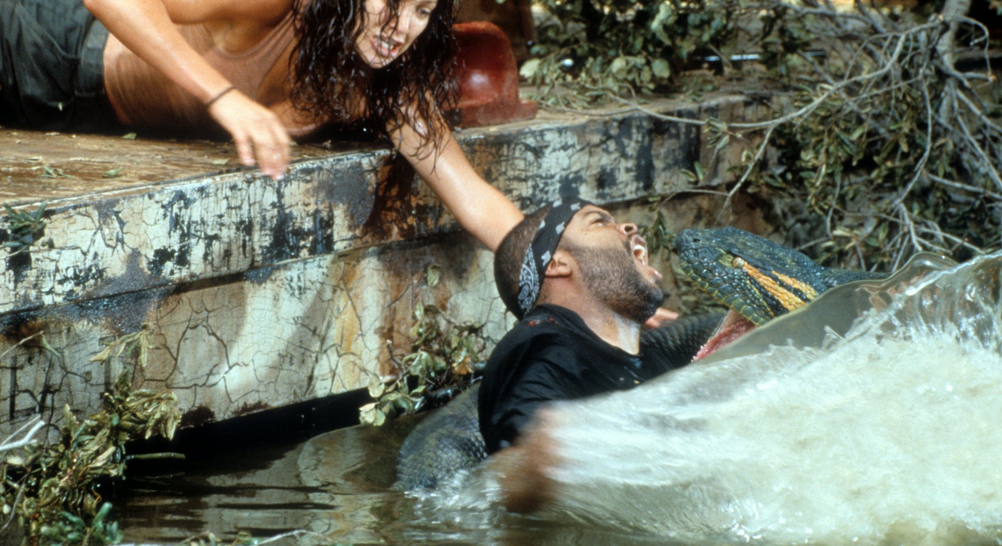 Jennifer Lopez reaching for Ice Cube as he's attacked in scene from the film 'Anaconda', 1997. (Phot...
