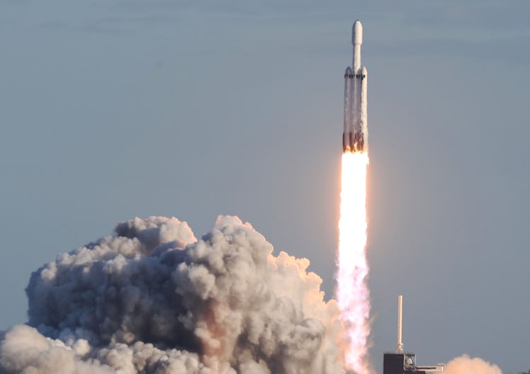 TITUSVILLE, FLORIDA - APRIL 11: The SpaceX Falcon Heavy rocket lifts off from launch pad 39A at NASA...