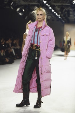 A model walks the runway in a hot pink puffer for Chanel in 1996. 