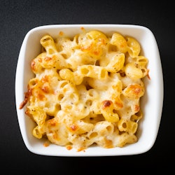 mac and cheese, macaroni pasta in cheesy sauce - American style
