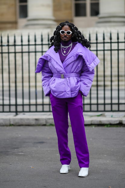 PARIS, FRANCE - JANUARY 27: A guest wears white sunglasses, silver rings in the hair, silver large c...