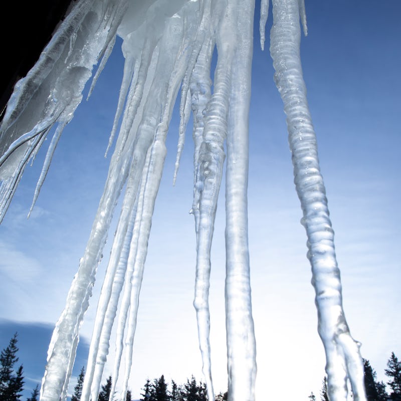 Canada, alberta, Lake Louise, jan 24/2022 Canadian rockies, huge long icicles hanging from roof of h...
