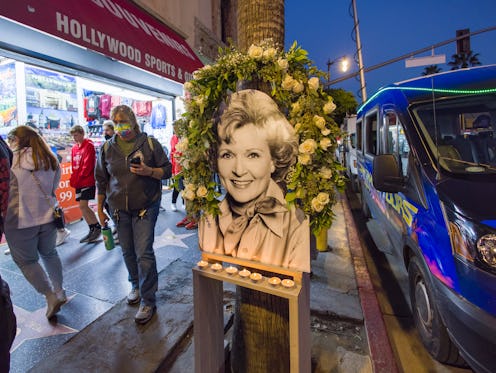 LOS ANGELES, CA - DECEMBER 31: Flowers and mementos in honor of Betty White are seen at her star on ...