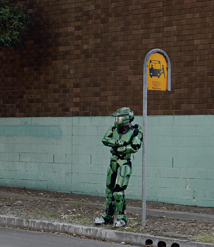 (AUSTRALIA OUT) Alexandria, Halo 2 computer game character Master Chief at a bus stop, 26 April 2005...