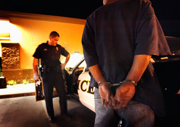 TUCSON, AZ - MAY 29: Tucson Police Officer Angel Ramirez arrests a man for trespassing May 29, 2010...