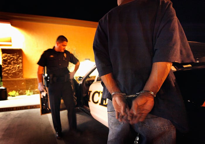 TUCSON, AZ - MAY 29:  Tucson Police Officer Angel Ramirez arrests a man for trespassing May 29, 2010...